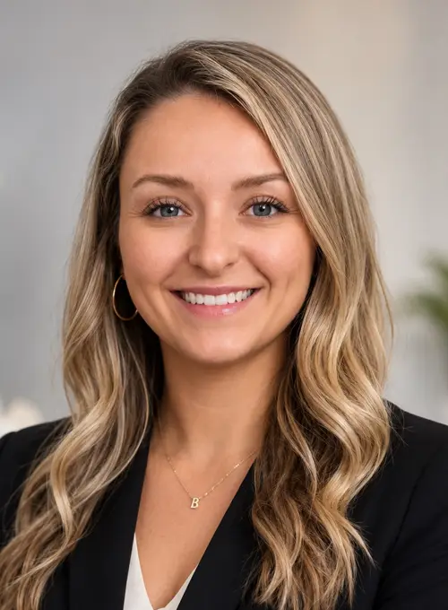 Dr. Aimee Day, D.C. smiling warmly at potential patients